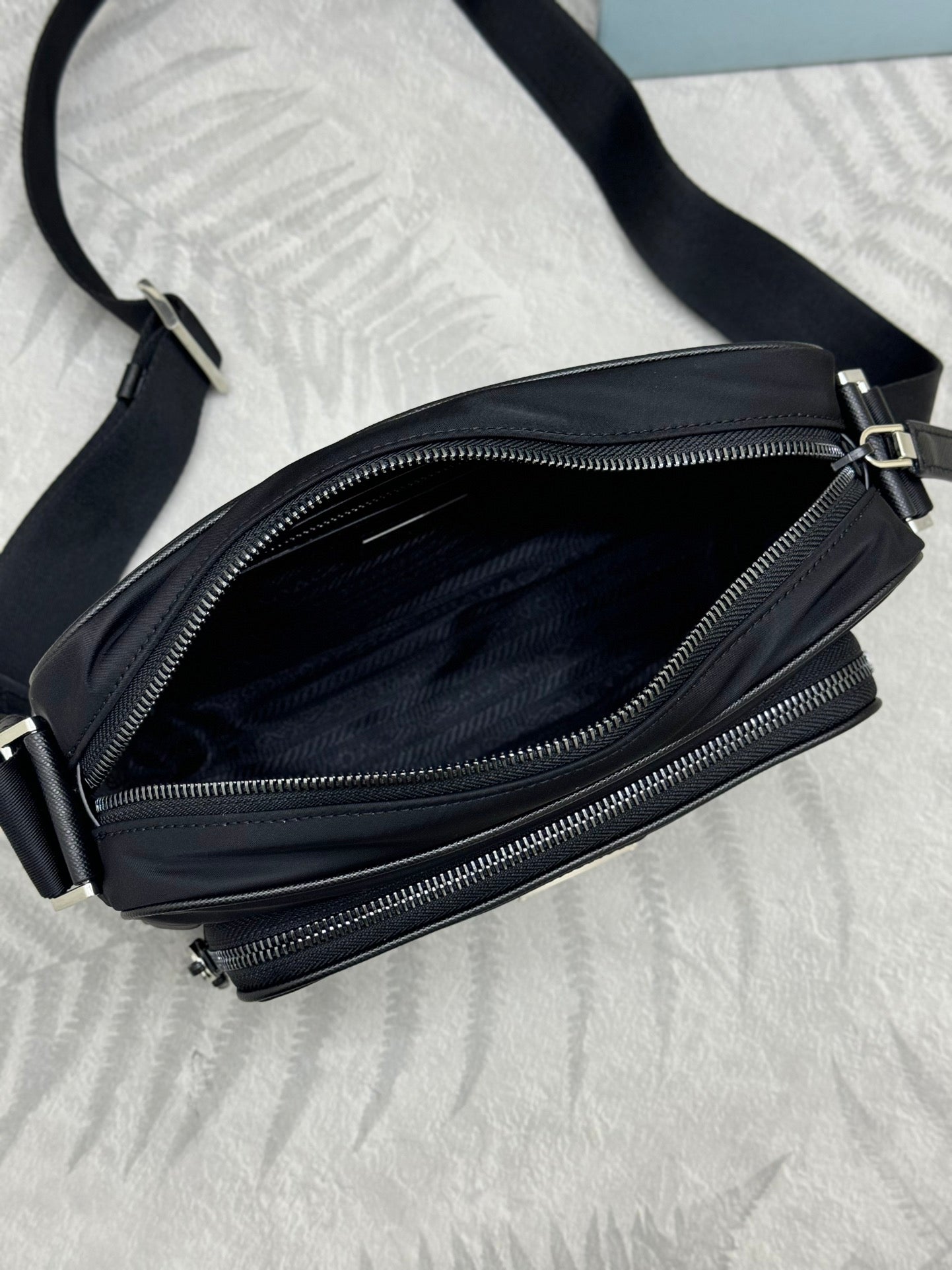 Prada bag, black crossbody with open zip pocket and dual zipper compartments
