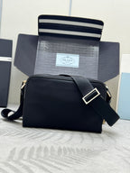 Prada bag, black crossbody shoulder style with front flap and wide strap