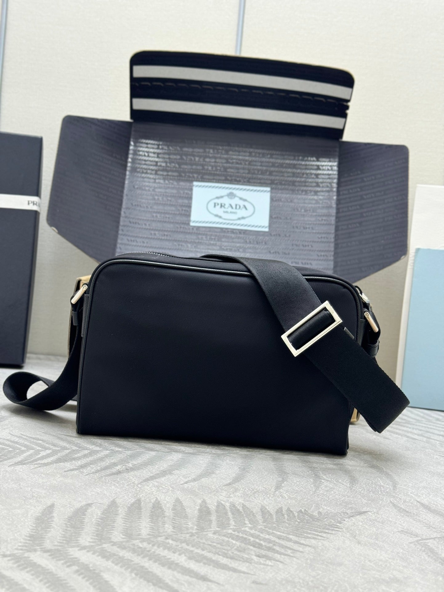 Prada bag, black crossbody shoulder style with front flap and wide strap