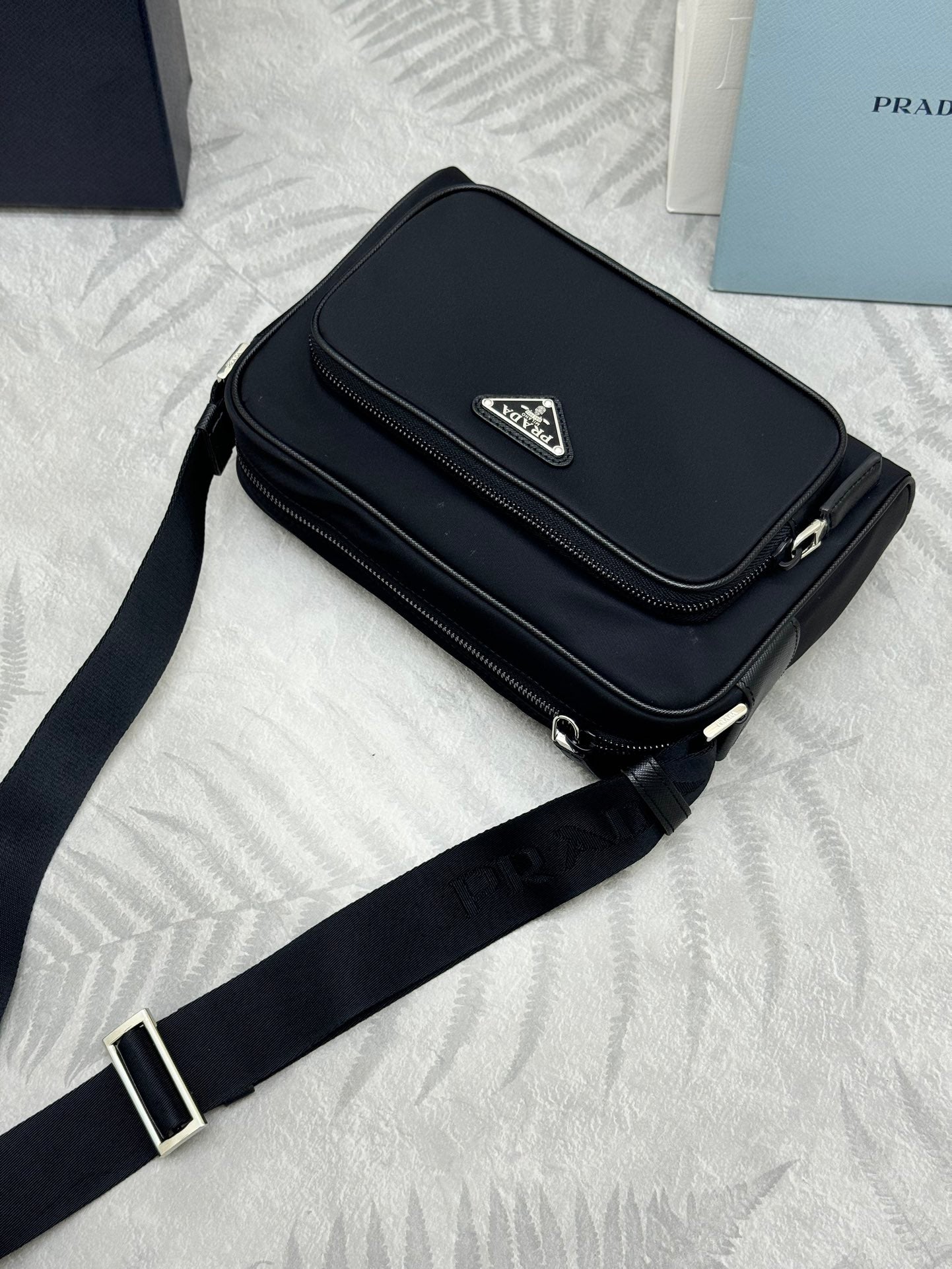 Prada bag, black flap crossbody with long strap and zip top closure