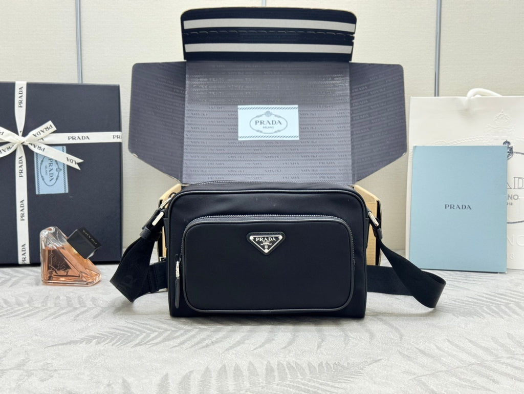 Prada bag, black crossbody with front flap, gold-tone hardware, adjustable strap