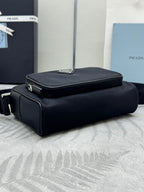 Prada bag, black structured top-handle with flap on front and zipper trim