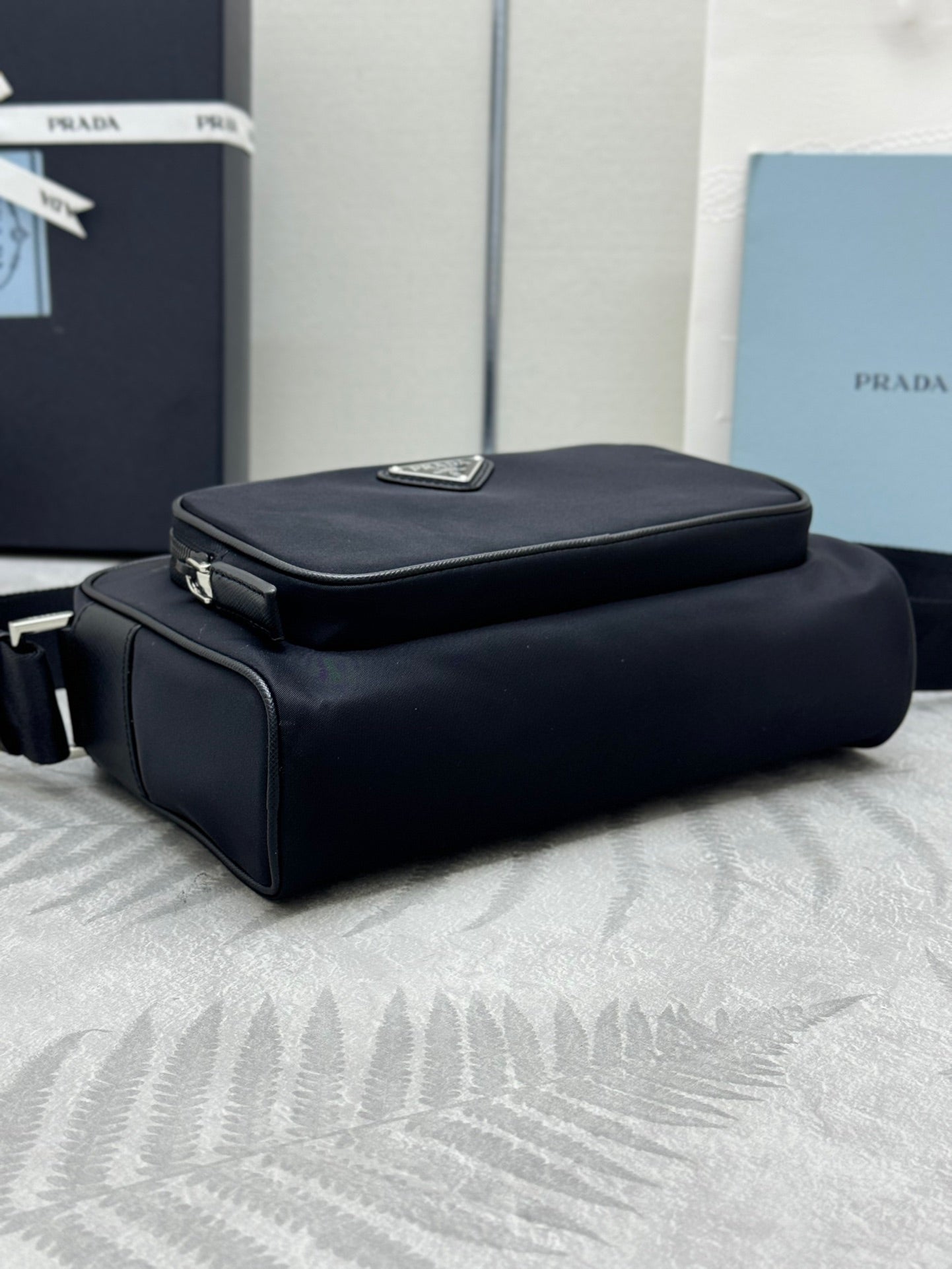 Prada bag, black structured top-handle with flap on front and zipper trim