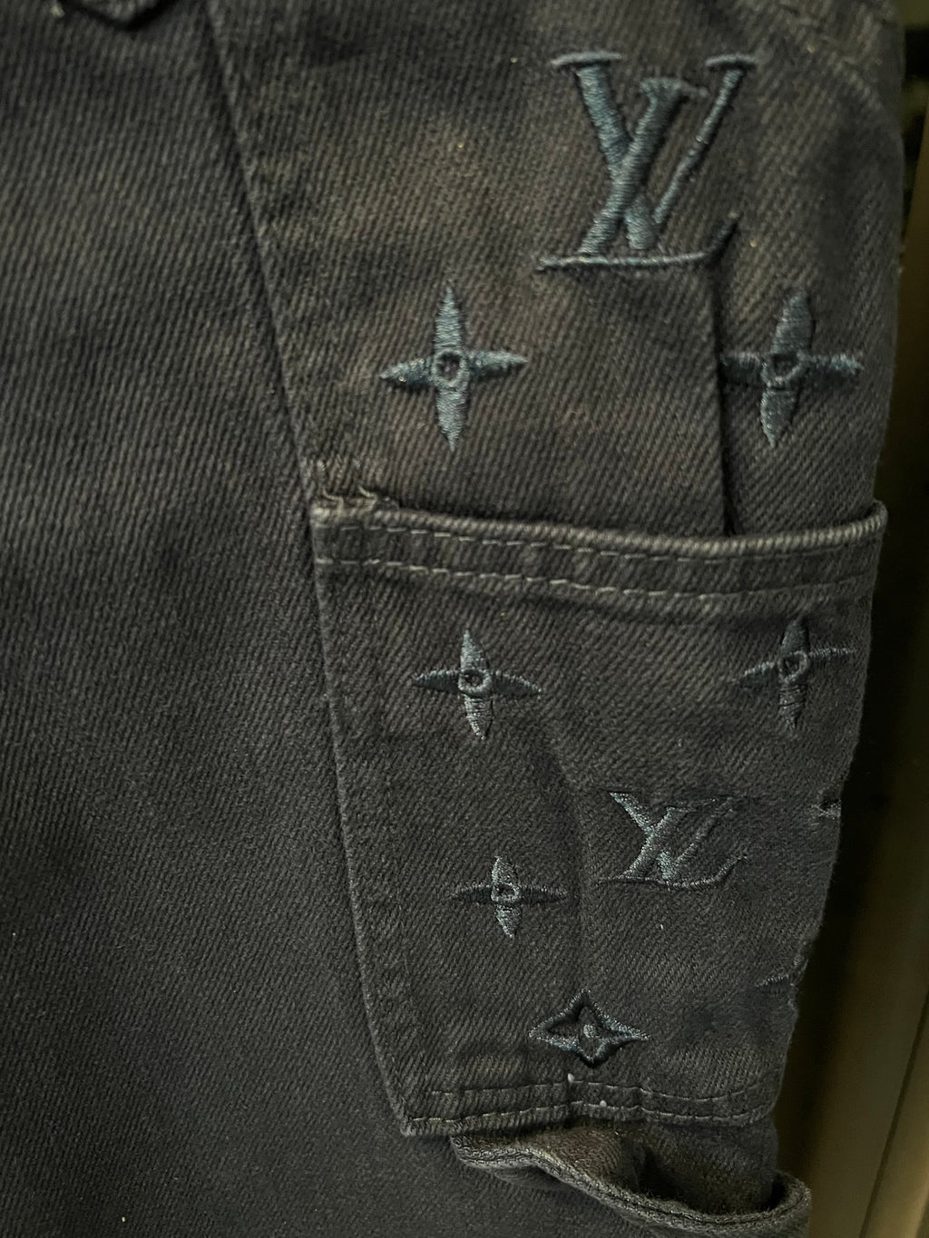 Dark blue denim cargo pants with embroidered LV monogram on front pocket