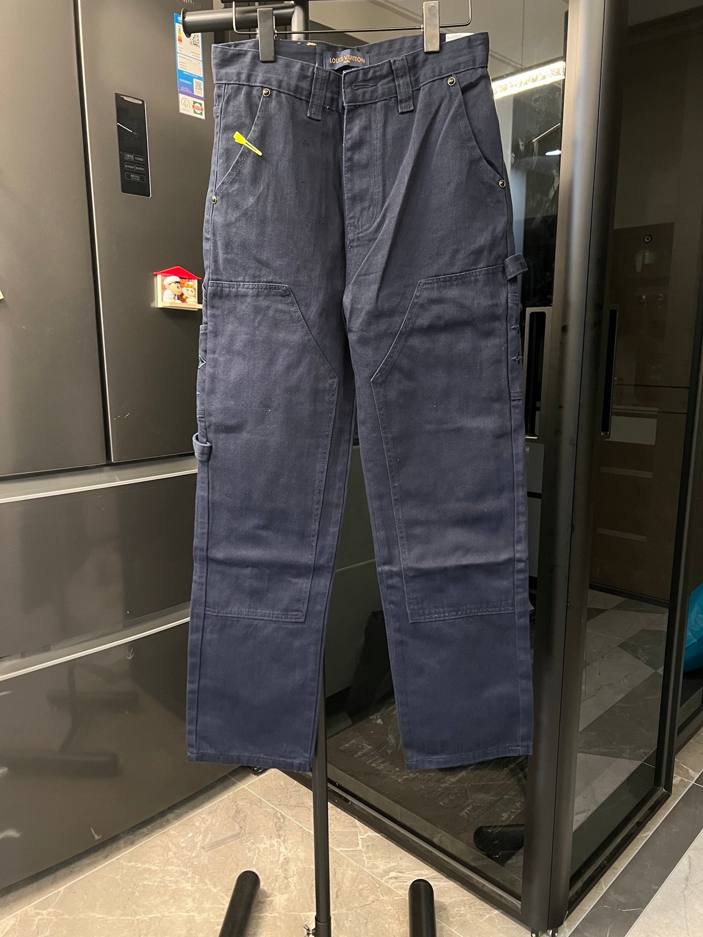 Louis Vuitton cargo pants, dark blue denim with front pockets and button waist