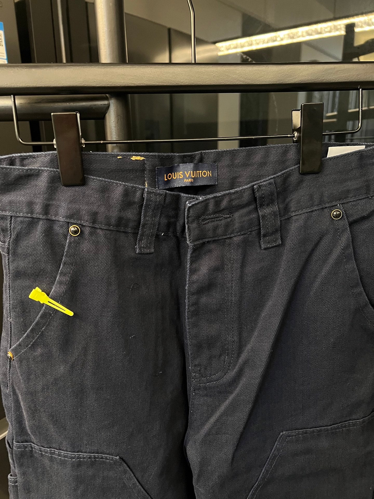 Dark blue denim cargo pants with LV logo patch, button waist and side pocket