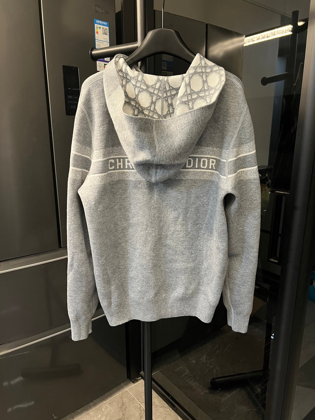 Grey zip-up hoodie with Dior monogram logo stripe across the chest and hood