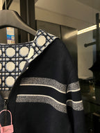 Side view of hooded zip-up jacket with lattice pattern panel and wide white-gray stripe band