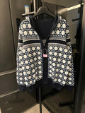 Hooded zip-up jacket with navy and white lattice pattern, ribbed dark cuffs and hem