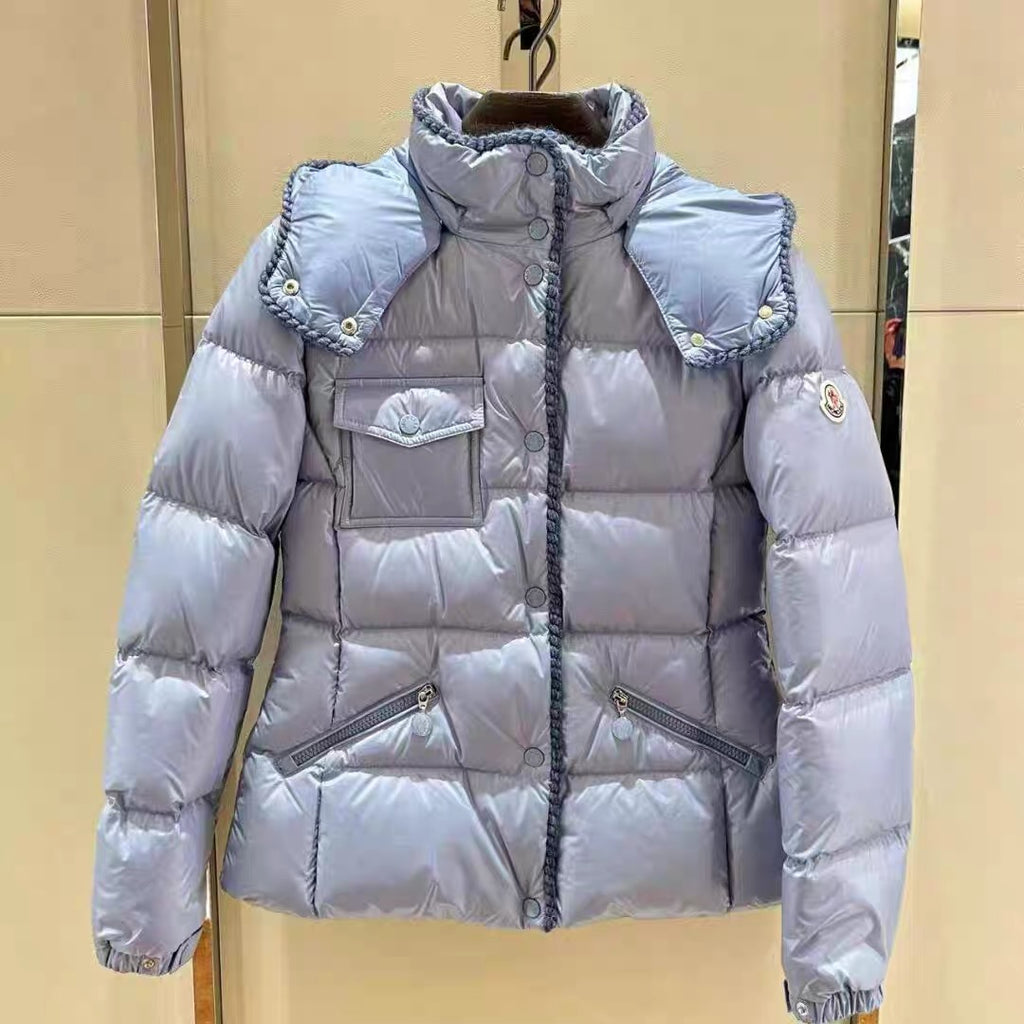 Light blue long puffer jacket with hood, snap buttons, and side pockets