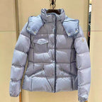 Light blue long puffer jacket with hood, snap buttons, and side pockets