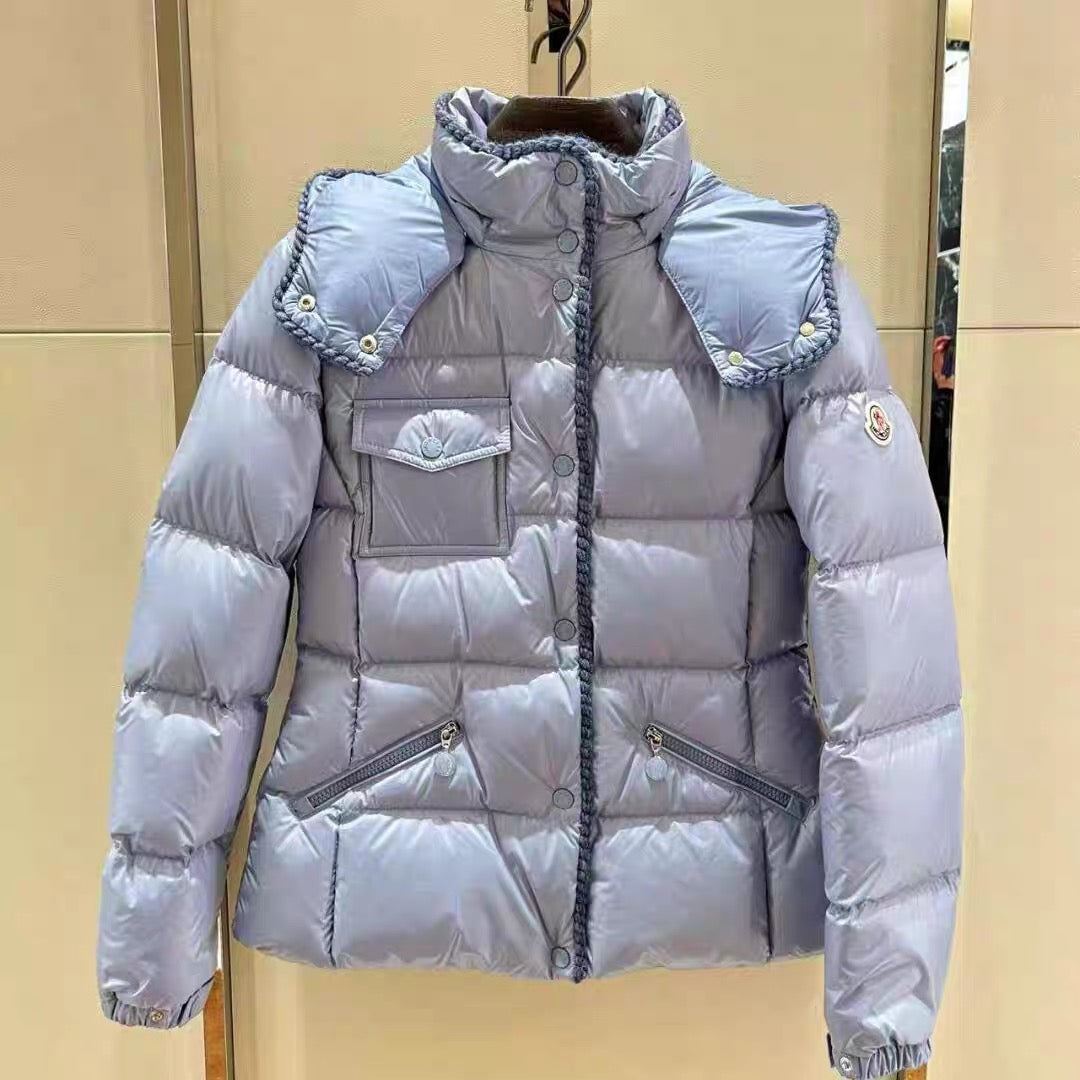 Light blue long puffer jacket with hood, snap buttons, and side pockets