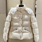 Moncler long hooded puffer jacket, white, front view with chest pocket and buttons
