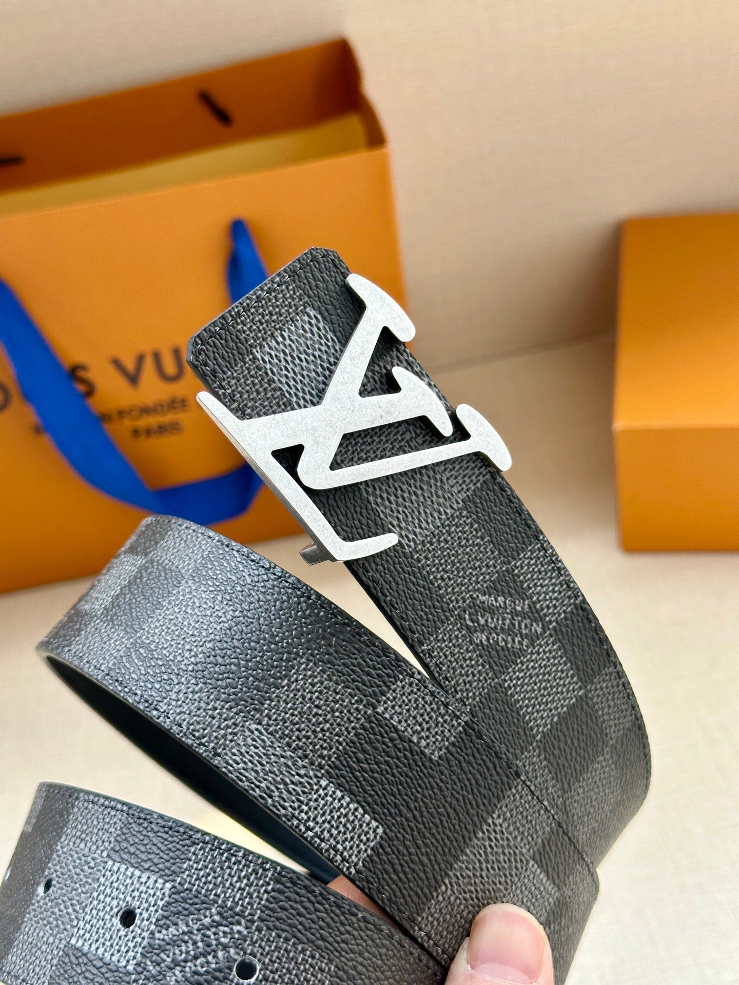 Louis Vuitton Damier check belt end with silver-toned LV buckle and holes