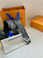 Louis Vuitton Damier check belt in dark gray with silver-toned LV buckle