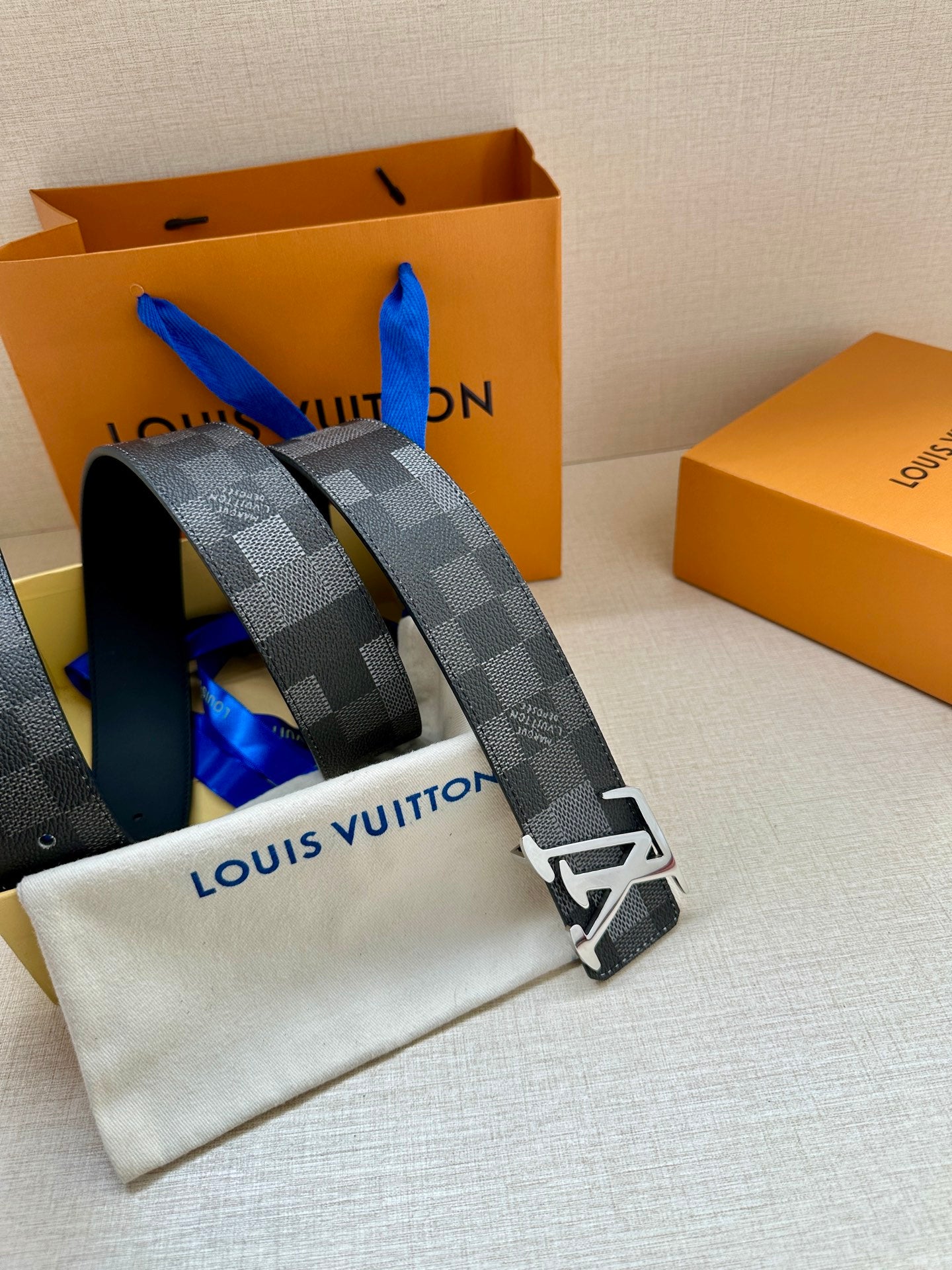 Louis Vuitton Damier check belt in dark gray with silver-toned LV buckle
