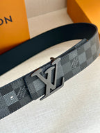 Louis Vuitton Damier check belt with silver-toned LV buckle and adjustment holes