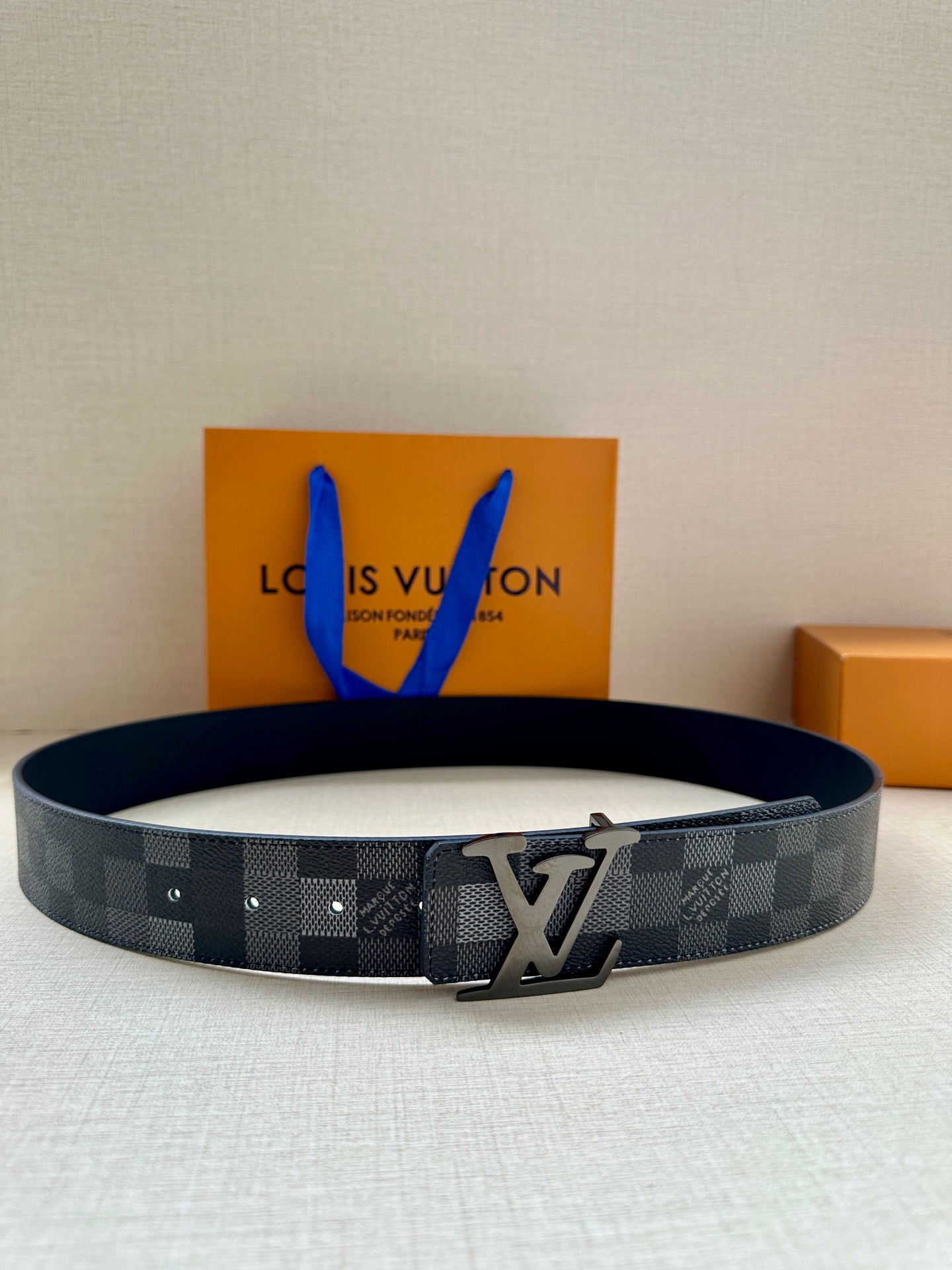 Louis Vuitton Damier check belt in dark gray with silver-toned LV buckle