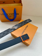Louis Vuitton belt with dark check pattern on box with orange card and orange buckle