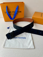 Louis Vuitton belt crossed on dust bag: dark monogram strap and black buckle