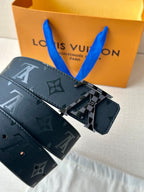 Louis Vuitton belt with dark navy monogram strap and silver "LV" buckle hardware