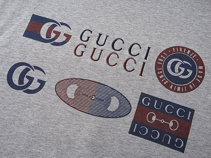 Grey T-shirt with multicolor Gucci logo print and crest emblem