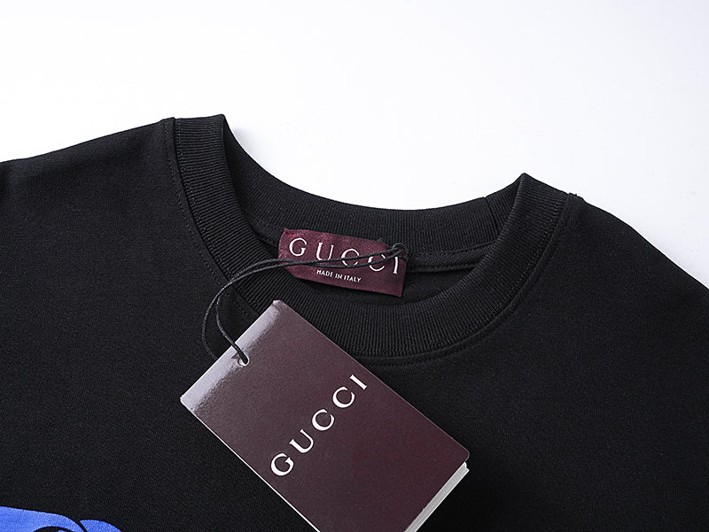 Black crew-neck T-shirt with inner neck tag and collar seam