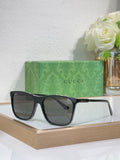 Gucci sunglasses with black frame and dark gradient lenses