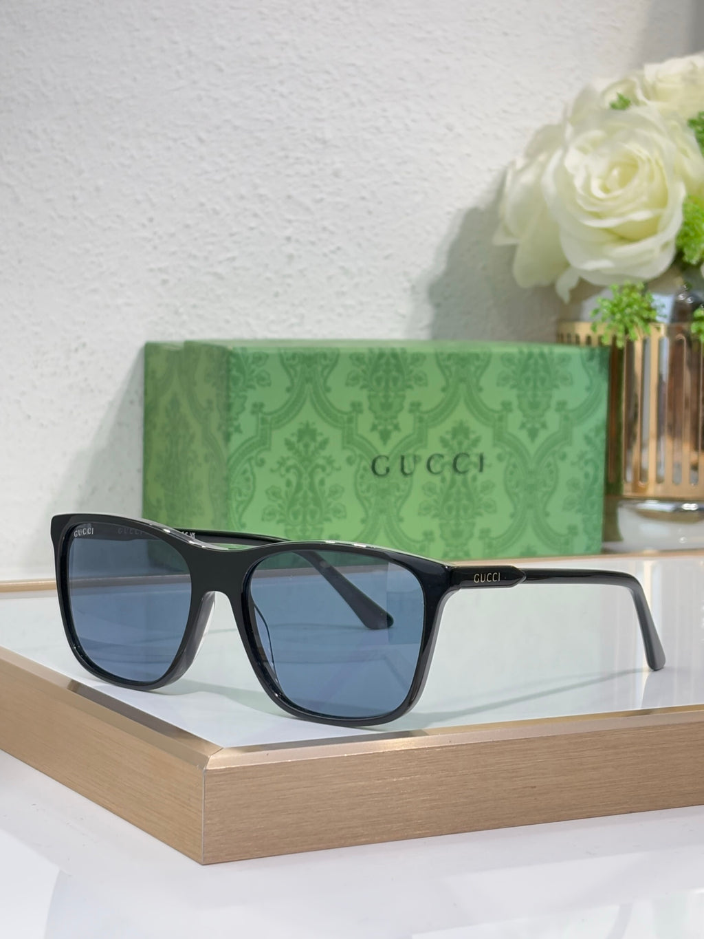 Gucci sunglasses with dark blue lenses and black frame