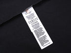 Black T-shirt with interior care label tag near side seam