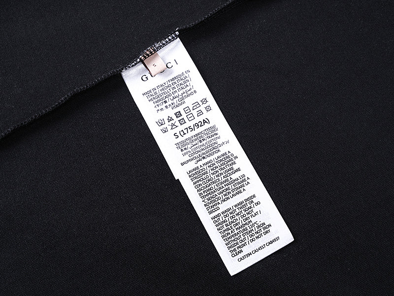 Black T-shirt with interior care label tag near side seam