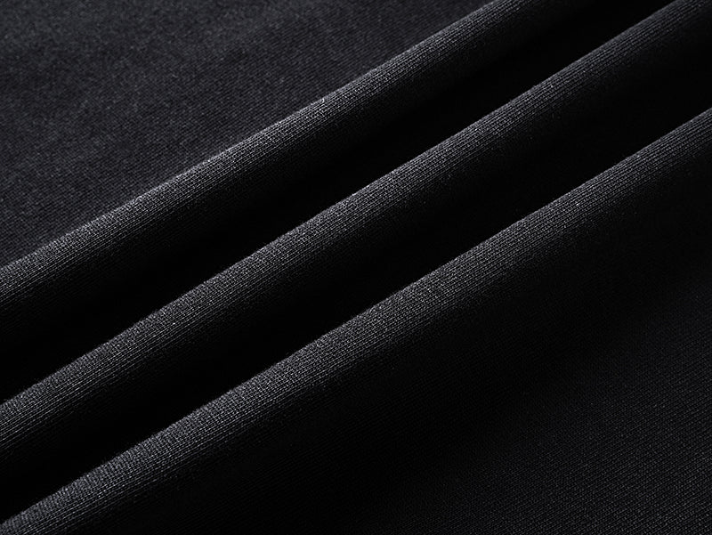 Black T-shirt fabric close-up with fine weave texture