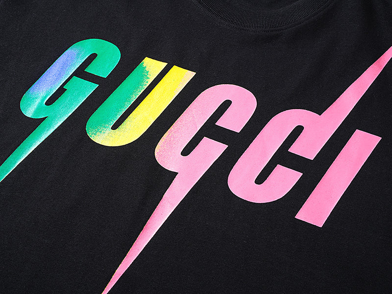 Close-up of Gucci multicolor lightning logo print on black T-shirt