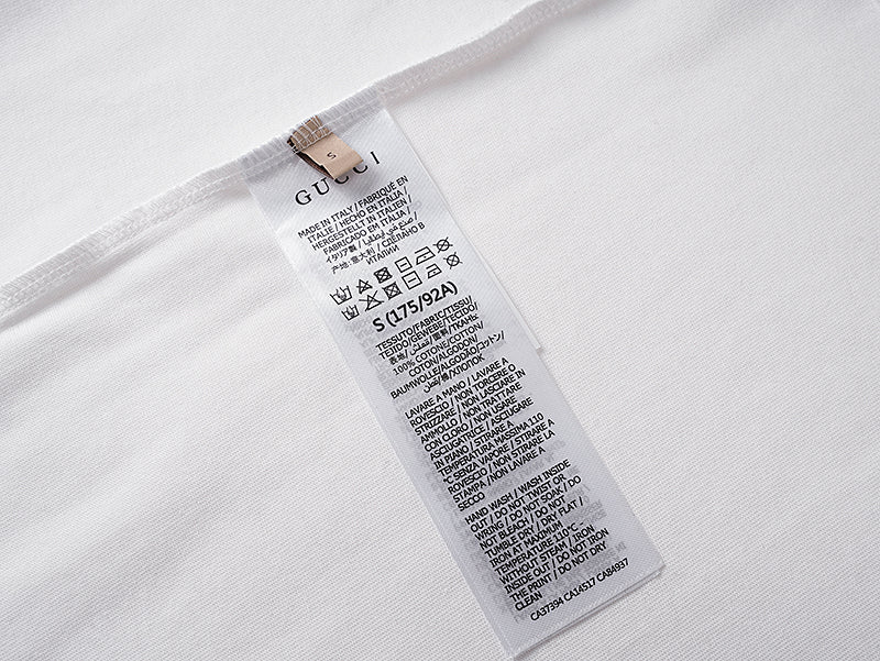 White Gucci T-shirt care label tag at inside neckline