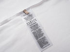 White Gucci T-shirt care label tag at inside neckline