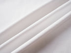 White Gucci T-shirt fabric close-up with smooth knit texture