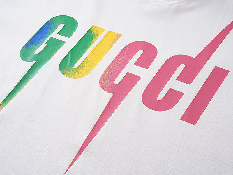 White Gucci T-shirt close-up of multicolor GUCCI logo print