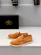 Tan suede loafers with strap vamp and white rubber sole edge