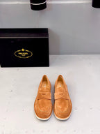 Tan suede loafers with strap and triangular stitching, slip-on style