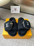 Louis Vuitton unisex black shearling slides with front zip and LV logo patch