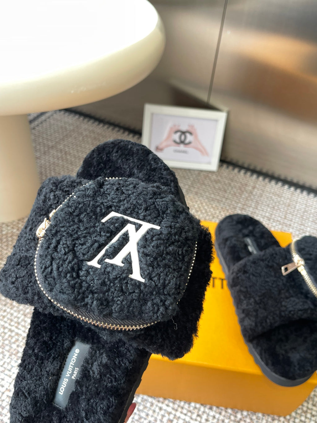 Louis Vuitton unisex black fuzzy slides with large letter logo patch and zipper edge