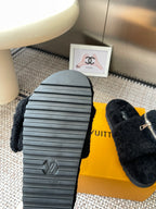 Louis Vuitton unisex black fuzzy slides with grooved rubber outsole