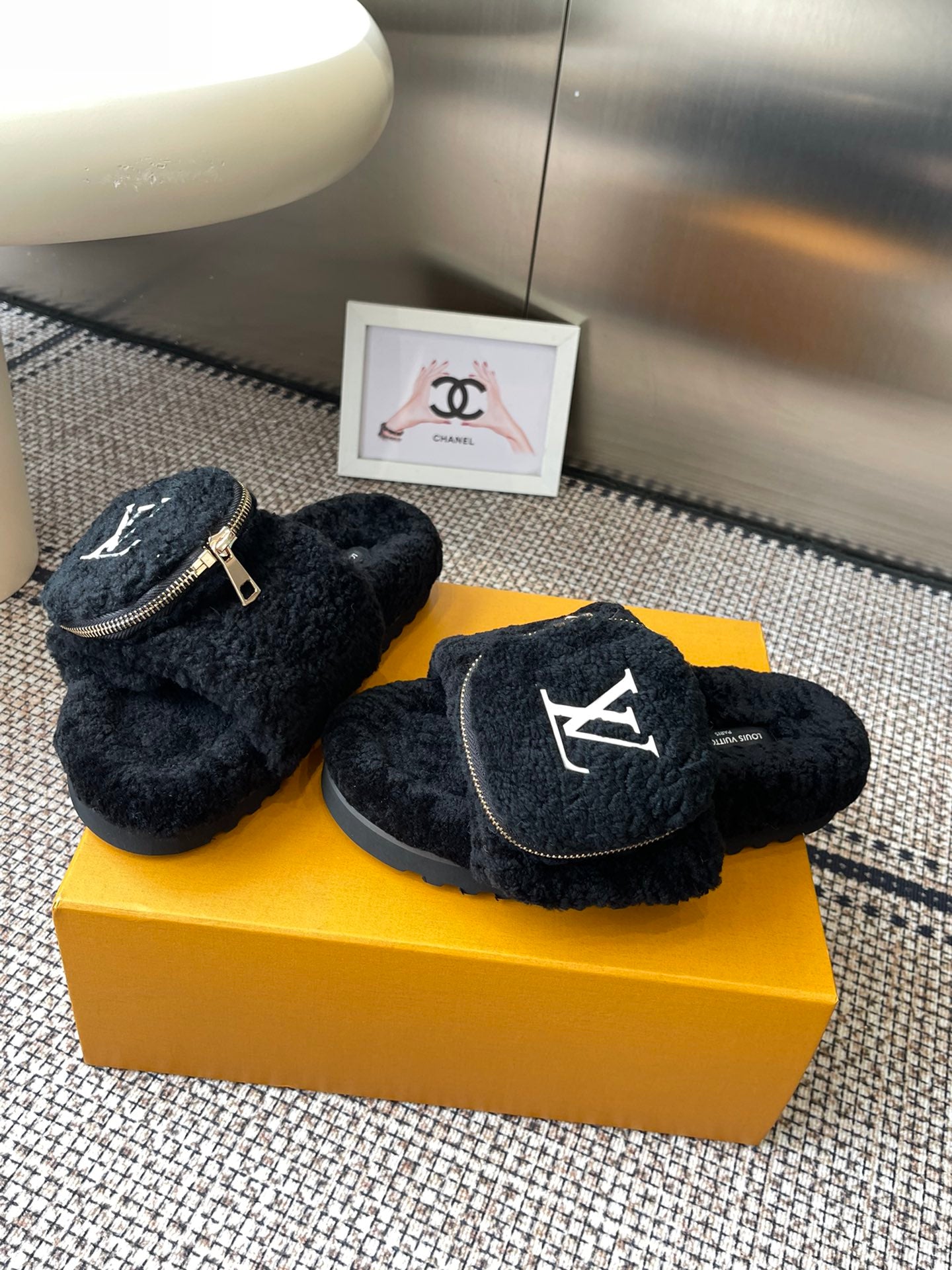 Louis Vuitton unisex black fuzzy slides with front logo patch and zipper strap