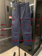 Dark blue denim cargo pants on retail rack