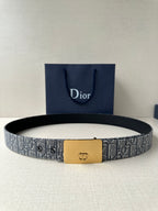 Dior belt with gray monogram pattern strap and gold-tone rectangular buckle