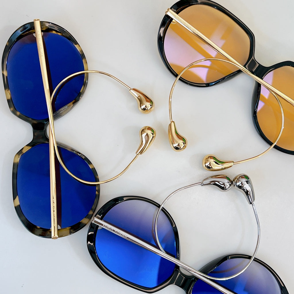 Sunglasses with blue lenses and gold and tortoiseshell frames
