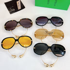 Sunglasses assortment with multicolor lenses and mixed gold, tortoiseshell, and black frames