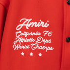 Red varsity jacket chest embroidery with cursive text and small star accents