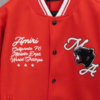 Red varsity jacket front with striped collar, chest embroidery, and cat graphic