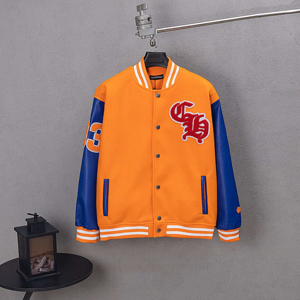 Orange and blue varsity jacket with striped ribbed collar, snap front, and chest patch